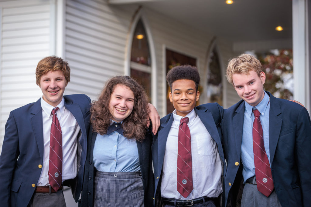 students in front of church