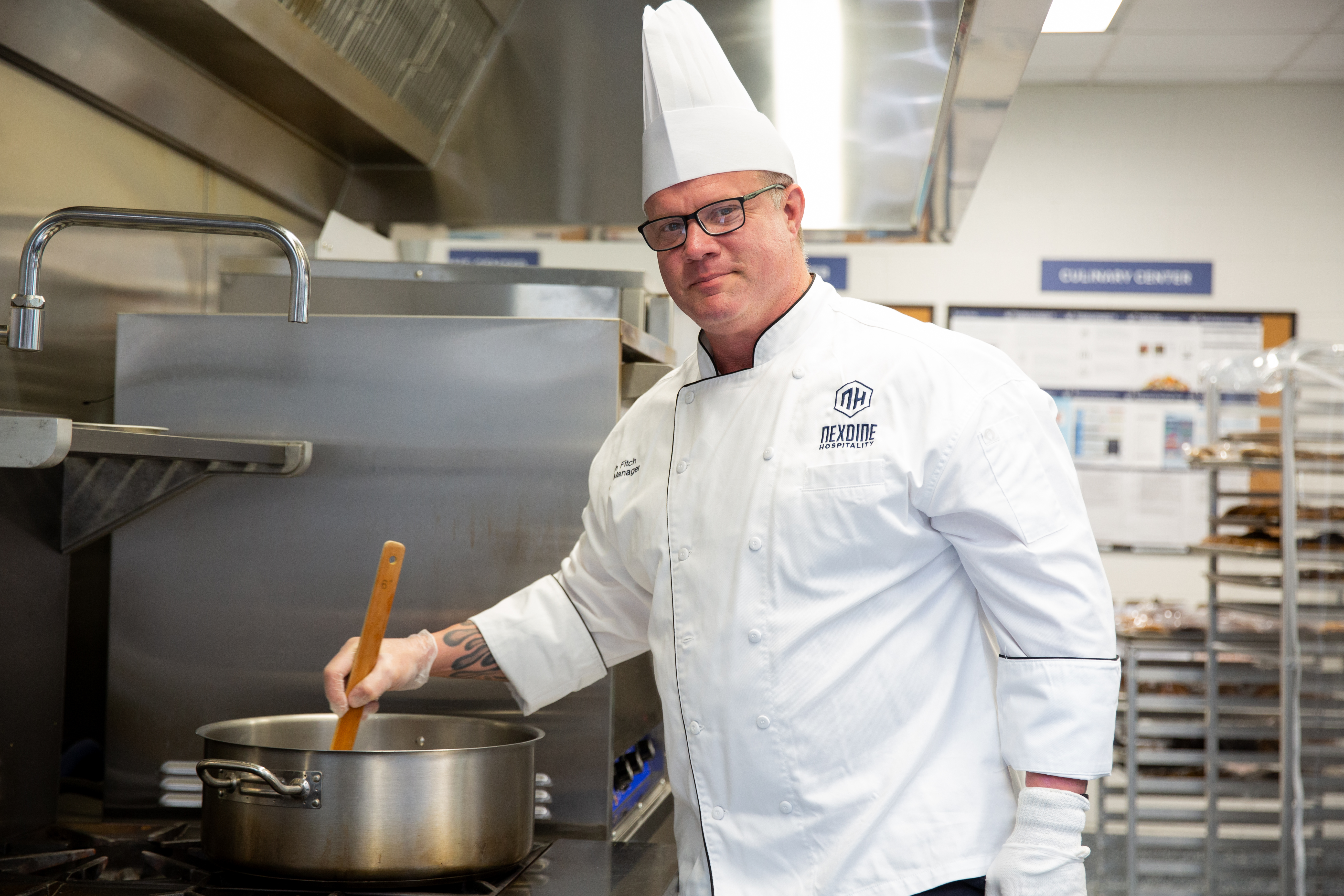 NEXDINE team member preparing food