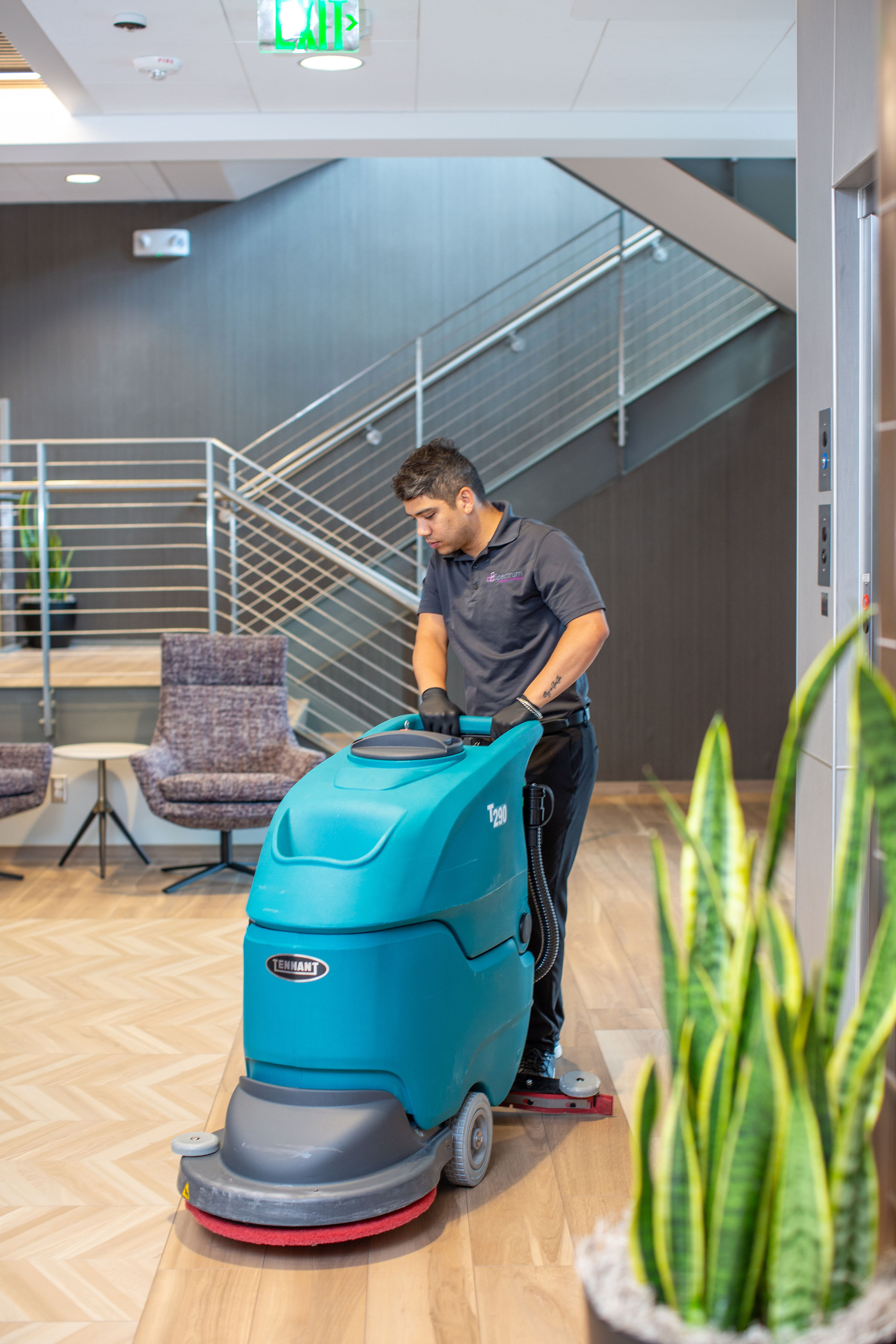 XENDELLA facilities team member cleaning a campus floor